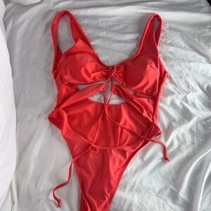 One piece, low back bathing suit with detailing upfront, beautiful orange